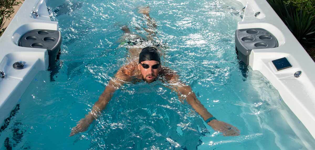 Michael Phelps swimming in a MasterSpas swim spa