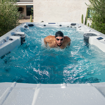 Phelps swimming in a swim spa.